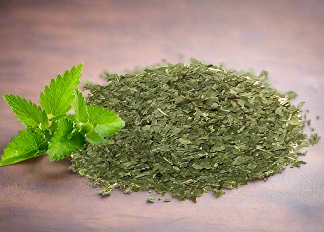 The Plants Mall resealable stand-up pouch of organic dried mint leaves showing product details, certifications, and vibrant green leaf content.